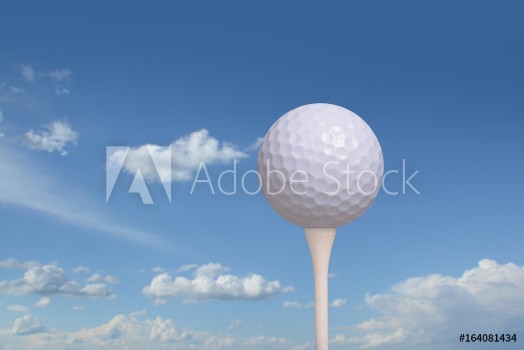 Picture of Golf ball on golf tee blue sky background